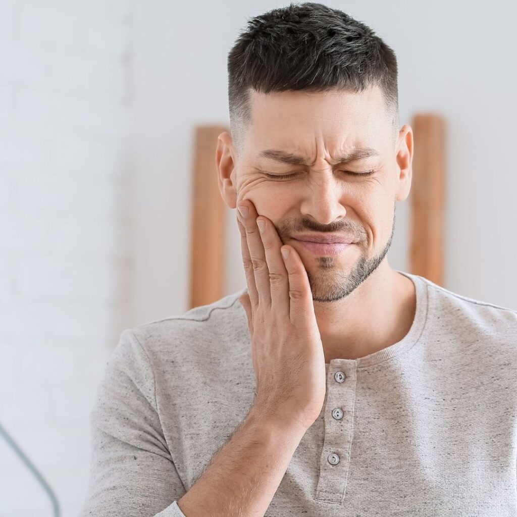 tooth sensitivity - man with tooth pain