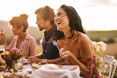 Woman enjoying a healthy meal with friends