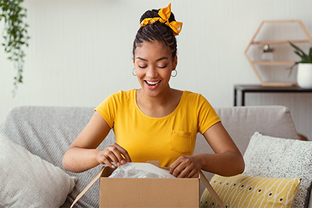 Woman opening a package